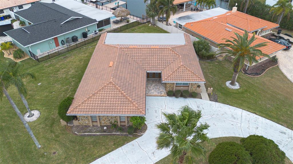 3734 Topsail Trail New Port Richey, FL 34652 - Photo 35 of 65 an aerial view of a house with a yard and potted plants