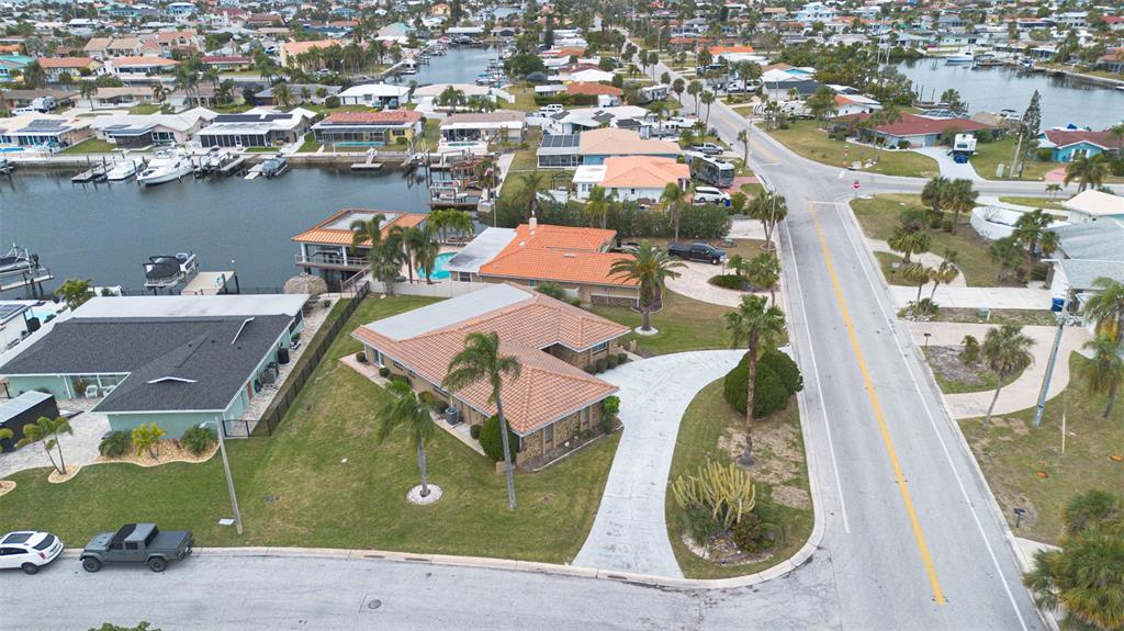 3734 Topsail Trail New Port Richey, FL 34652 - Photo 37 of 65 an aerial view of a house with outdoor space and a lake view in a city