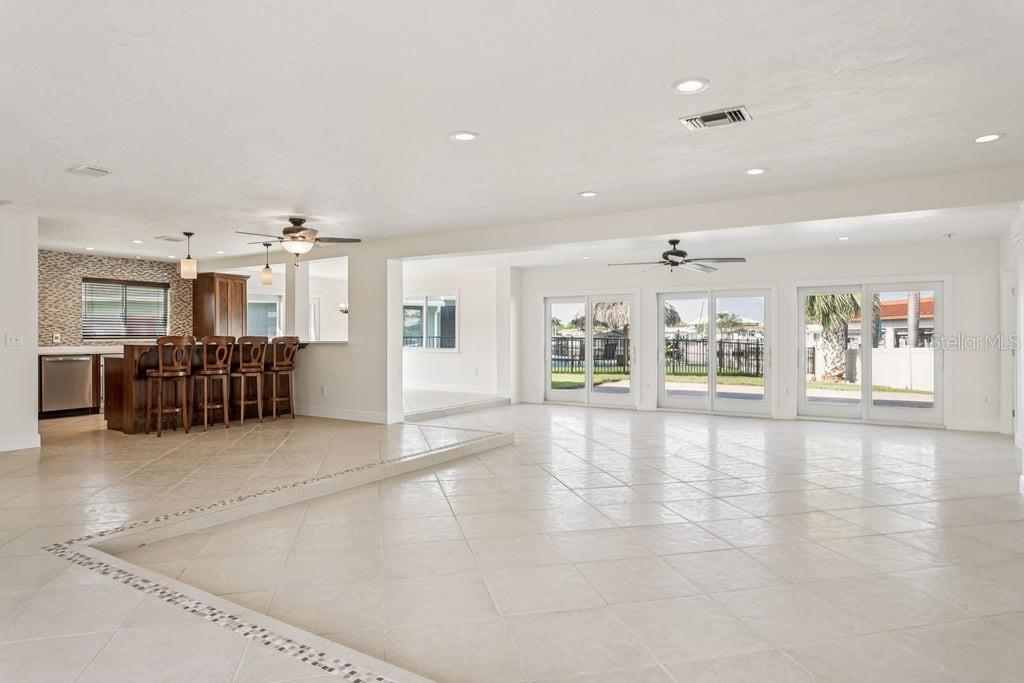 3734 Topsail Trail New Port Richey, FL 34652 - Photo 4 of 65 a view of a hall with kitchen and windows