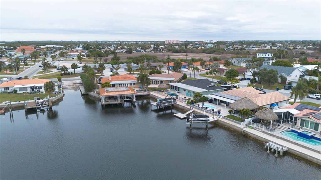 3734 Topsail Trail New Port Richey, FL 34652 - Photo 42 of 65 a view of a lake with a table and chairs