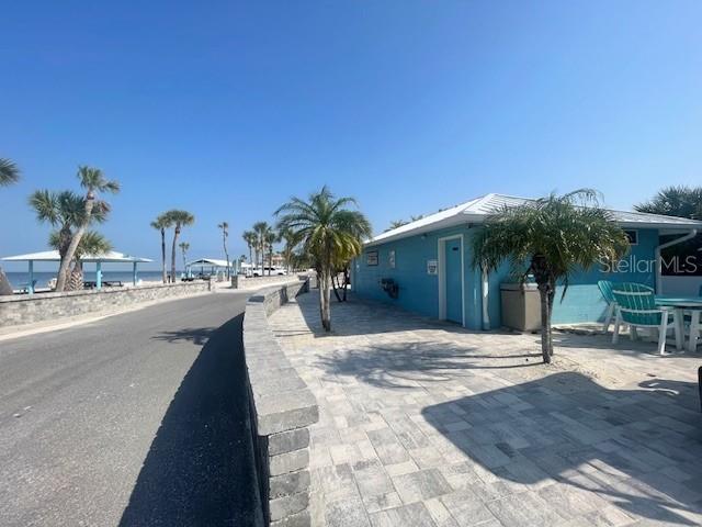 3734 Topsail Trail New Port Richey, FL 34652 - Photo 44 of 65 a swimming pool with outdoor seating and yard