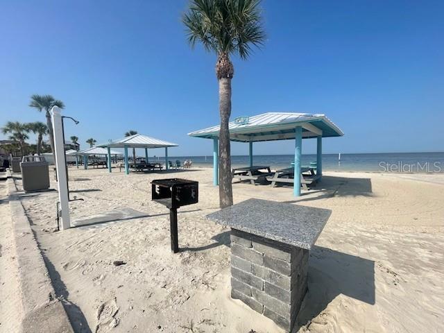 3734 Topsail Trail New Port Richey, FL 34652 - Photo 47 of 65 a view of a swimming pool with a table and chairs