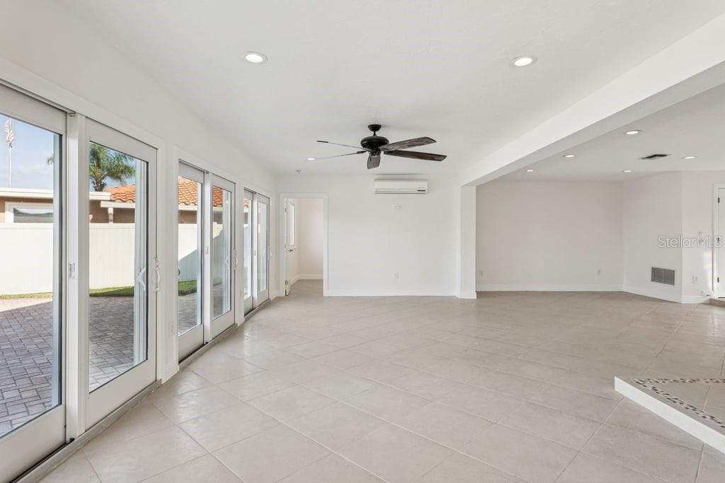 3734 Topsail Trail New Port Richey, FL 34652 - Photo 9 of 65 a view of a livingroom with wooden floor and a ceiling fan