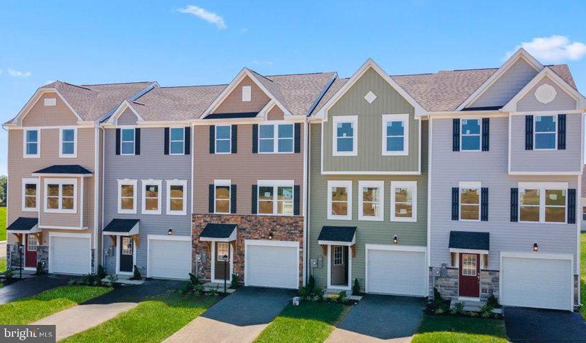 463 Zander Road Inwood, WV 25428 - Photo 2 of 12 a front view of a house with a yard