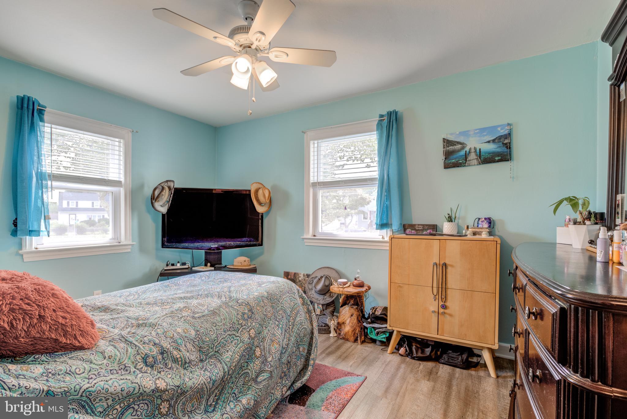 121 Leconey Circle Palmyra, NJ 08065 - Photo 11 of 33 a bedroom with a bed and wooden floor