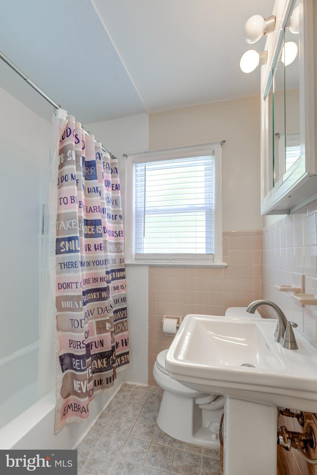121 Leconey Circle Palmyra, NJ 08065 - Photo 15 of 33 a bathroom with a sink a toilet and shower