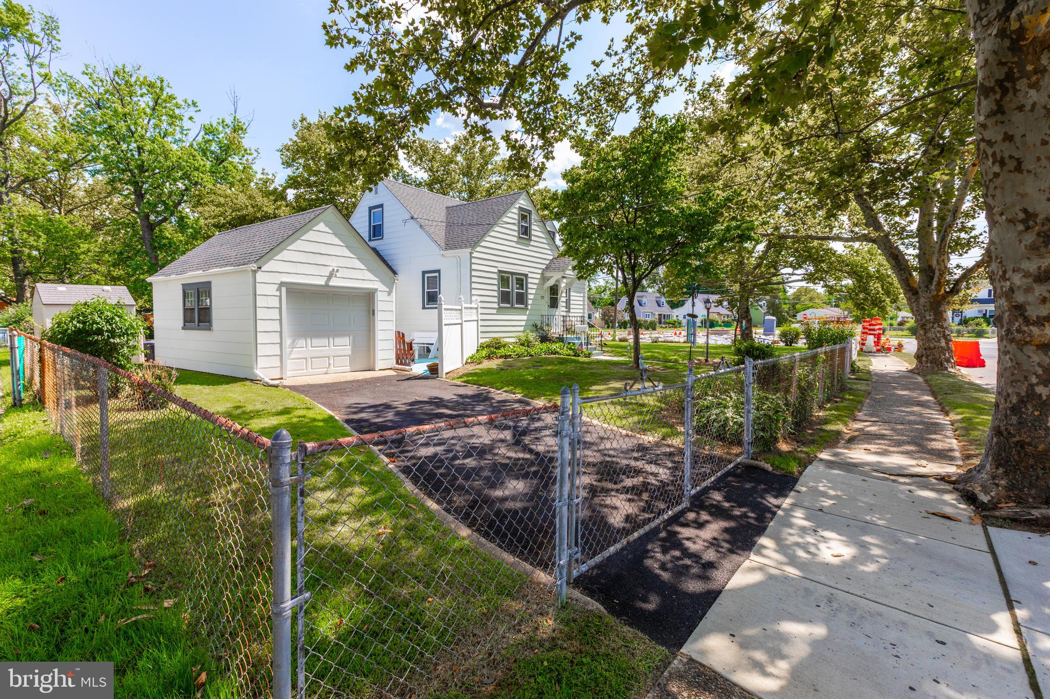 121 Leconey Circle Palmyra, NJ 08065 - Photo 2 of 33 a front view of a house with garden