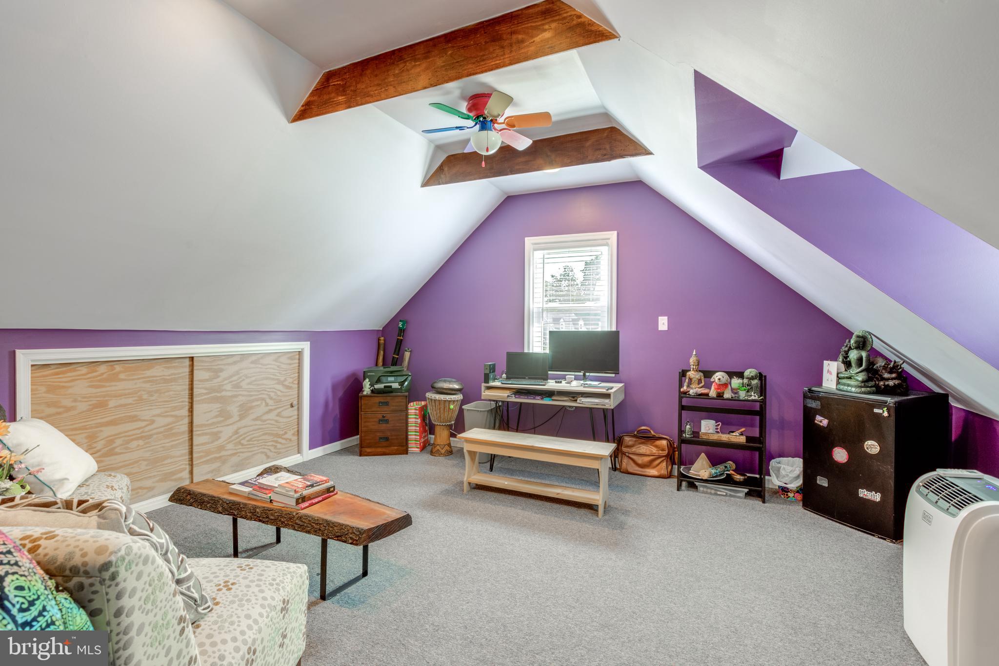 121 Leconey Circle Palmyra, NJ 08065 - Photo 21 of 33 a living room with furniture a rug and a lamp