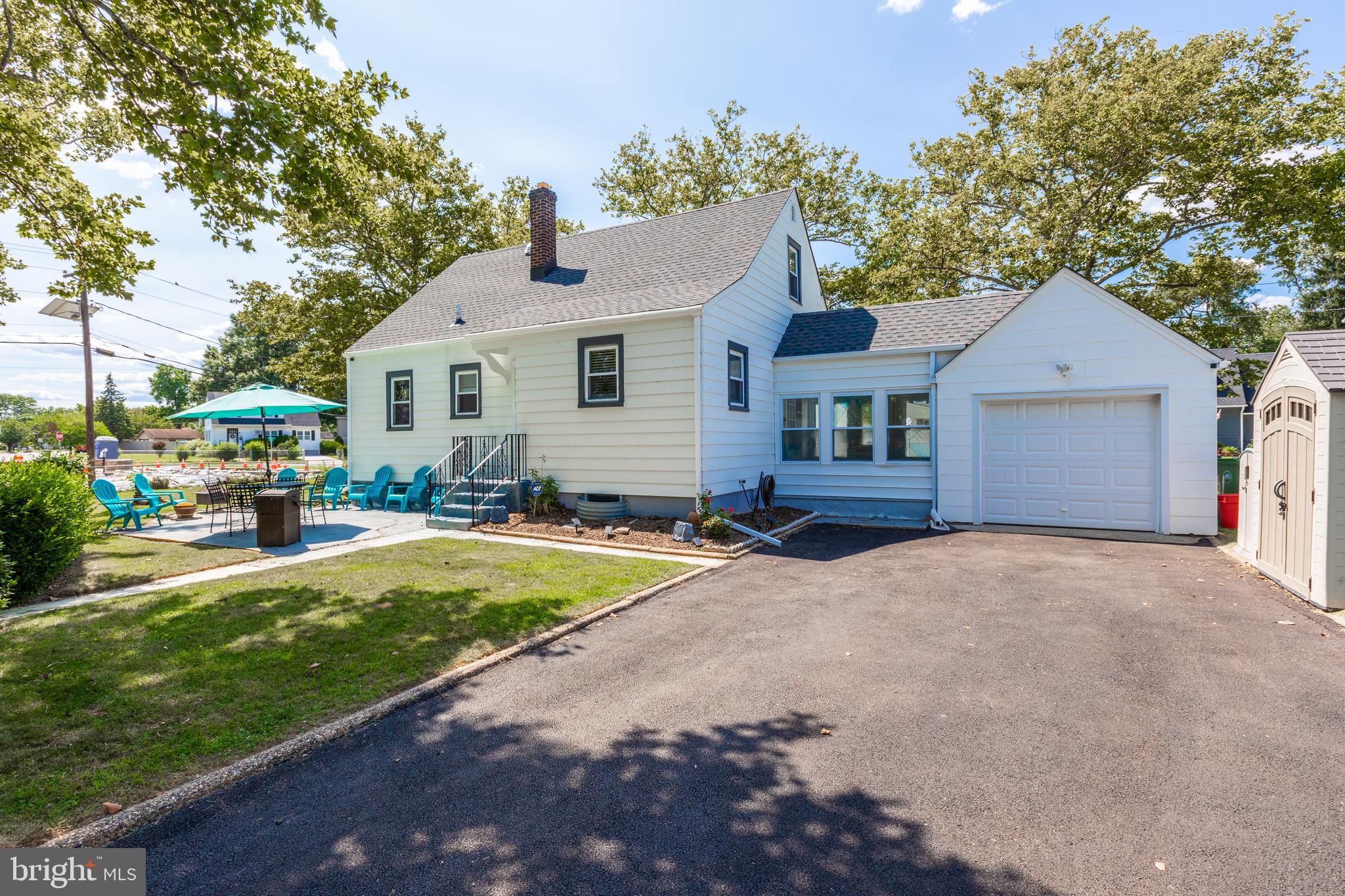 121 Leconey Circle Palmyra, NJ 08065 - Photo 33 of 33 a front view of a house with a yard and trees