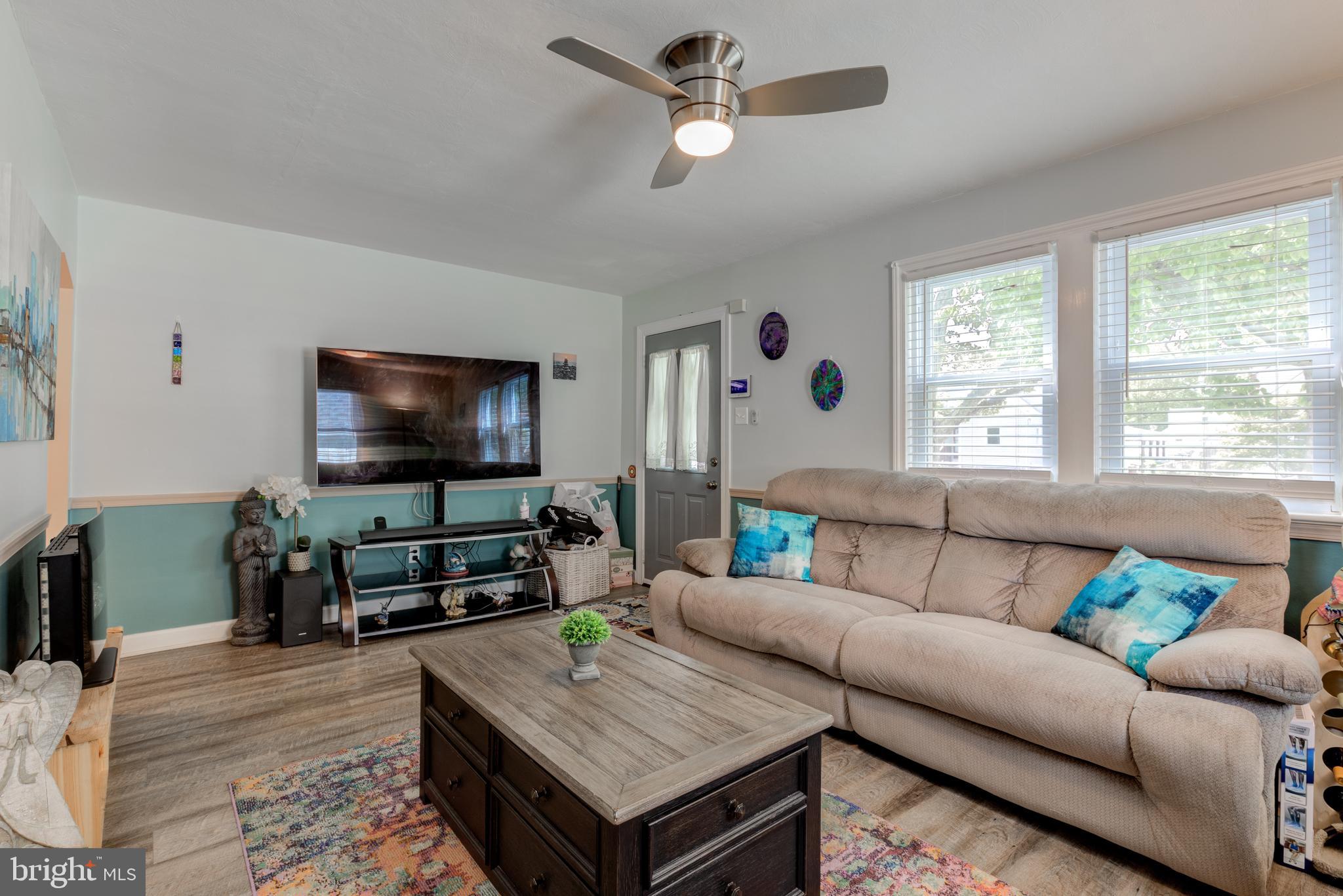 121 Leconey Circle Palmyra, NJ 08065 - Photo 6 of 33 a living room with furniture and a flat screen tv