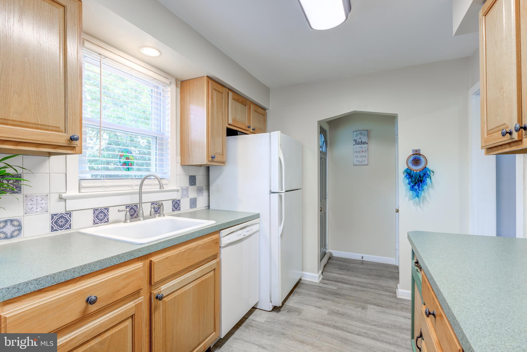 121 Leconey Circle Palmyra, NJ 08065 - Photo 10 of 33 a kitchen with a sink a refrigerator and a sink