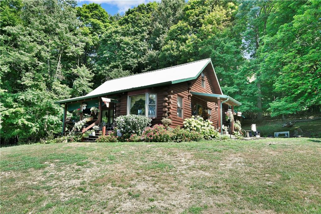69 Lover Jonestown Road Charleroi, PA 15022 - Photo 3 of 46 Exceptionally well built Log Home in the center of 3.748 acres includes is an oversized 2 car garage with loft storage