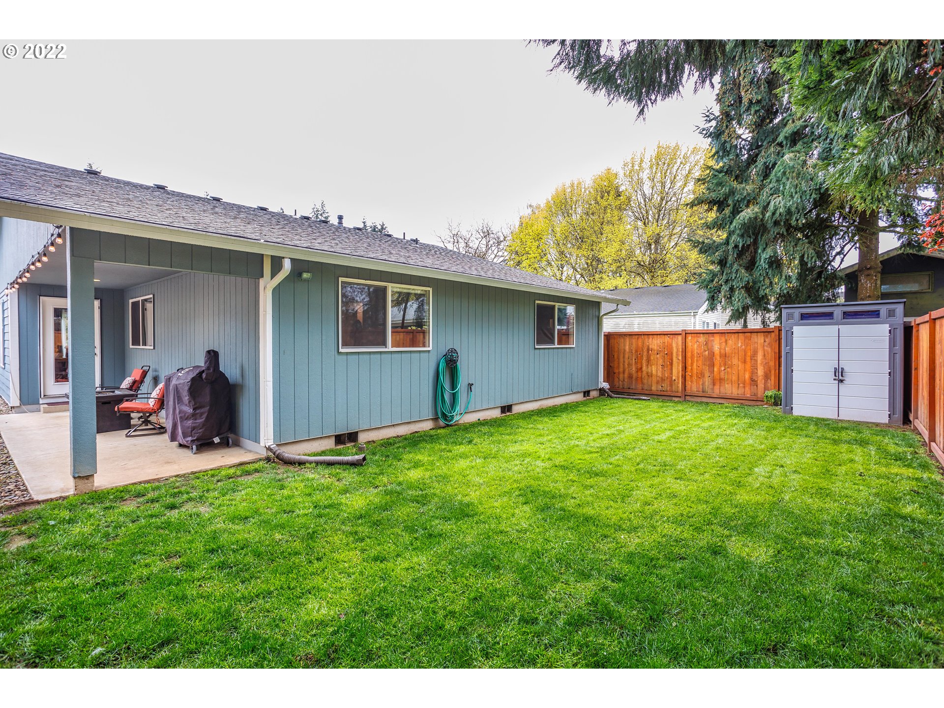 711 North Main Avenue Ridgefield, WA 98642 - Photo 14 of 14 a view of a backyard with a garden and plants