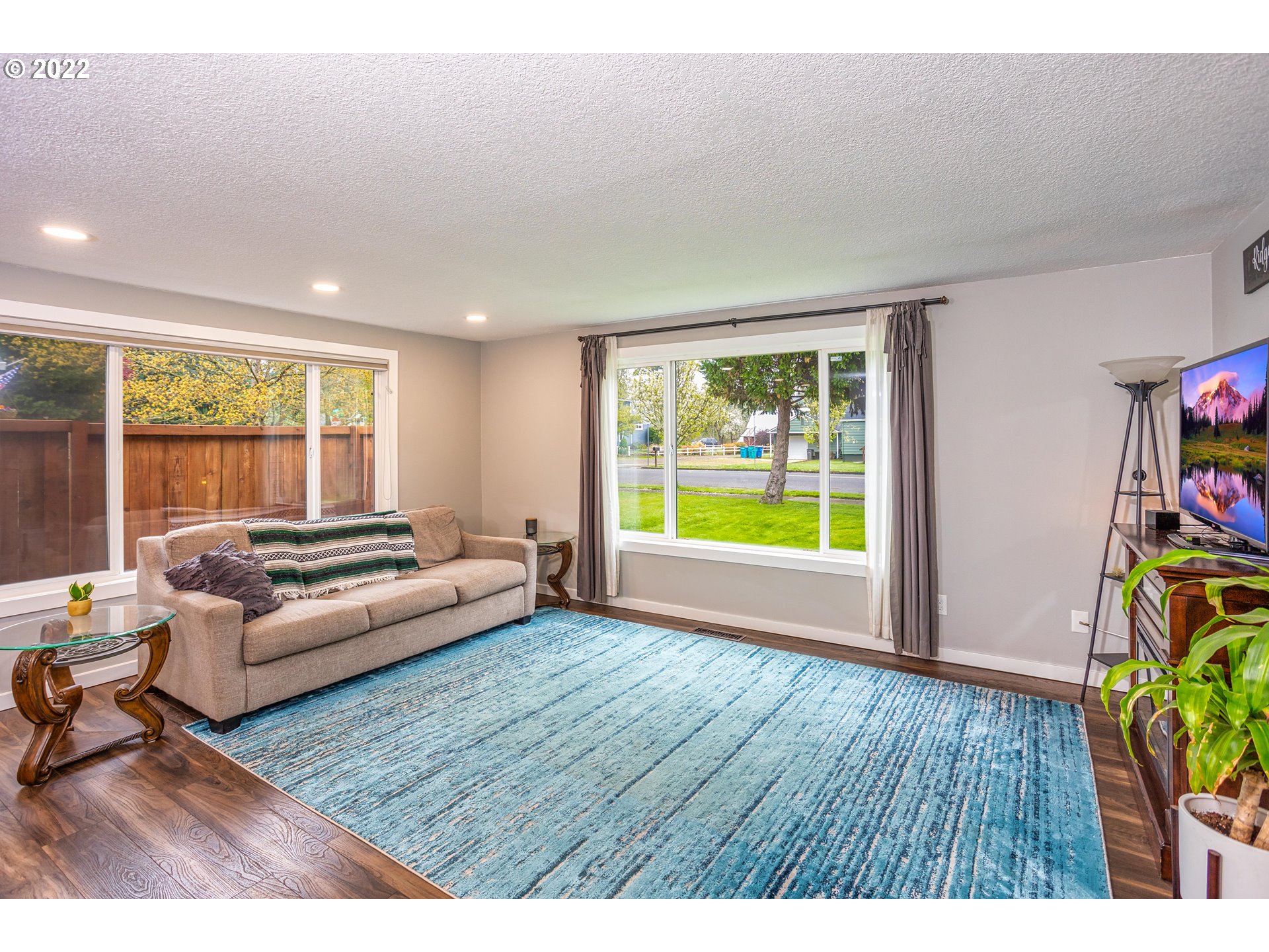 711 North Main Avenue Ridgefield, WA 98642 - Photo 3 of 14 a living room with furniture and a wooden floor