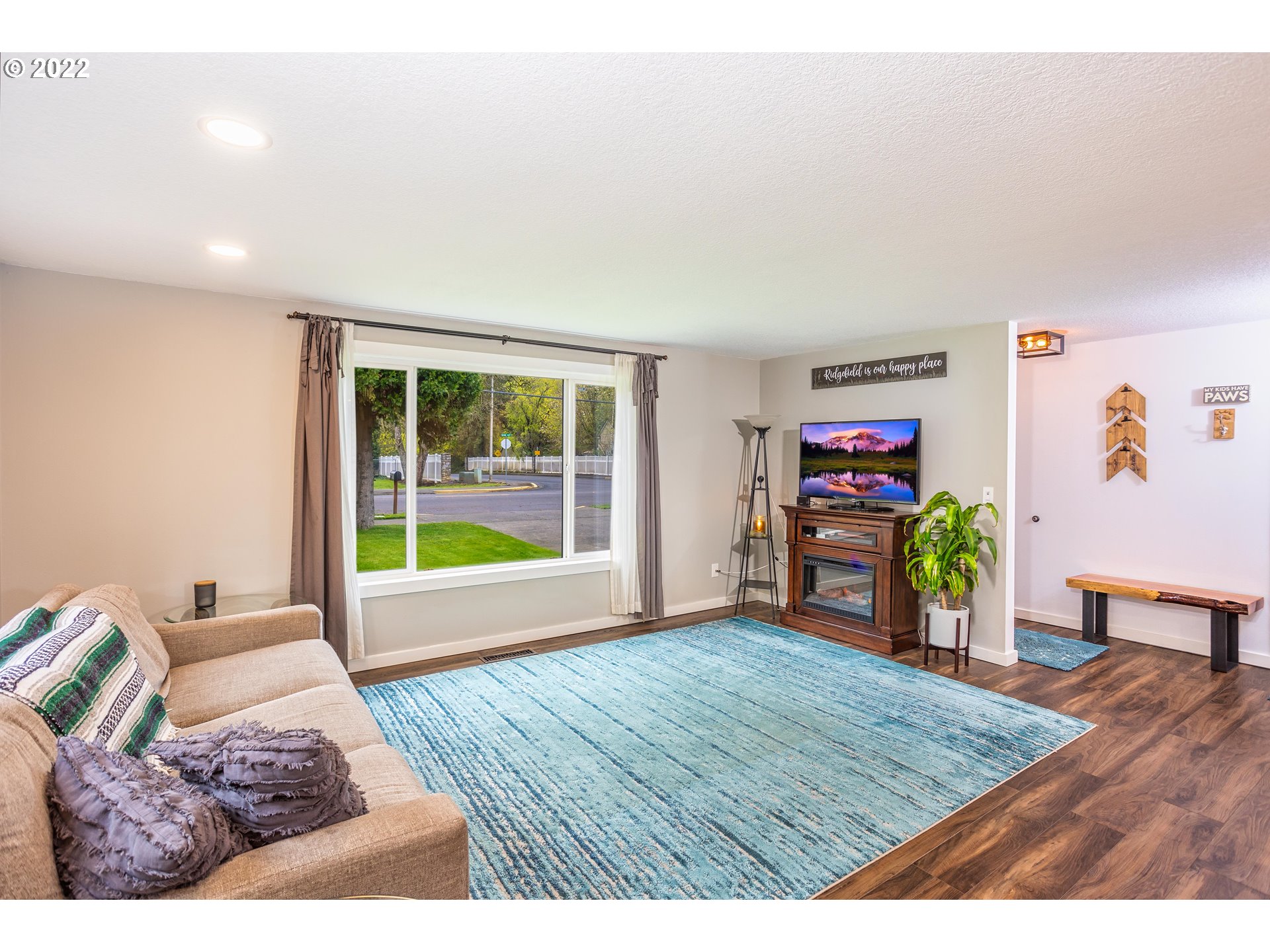 711 North Main Avenue Ridgefield, WA 98642 - Photo 4 of 14 a view of a bedroom with furniture and a window