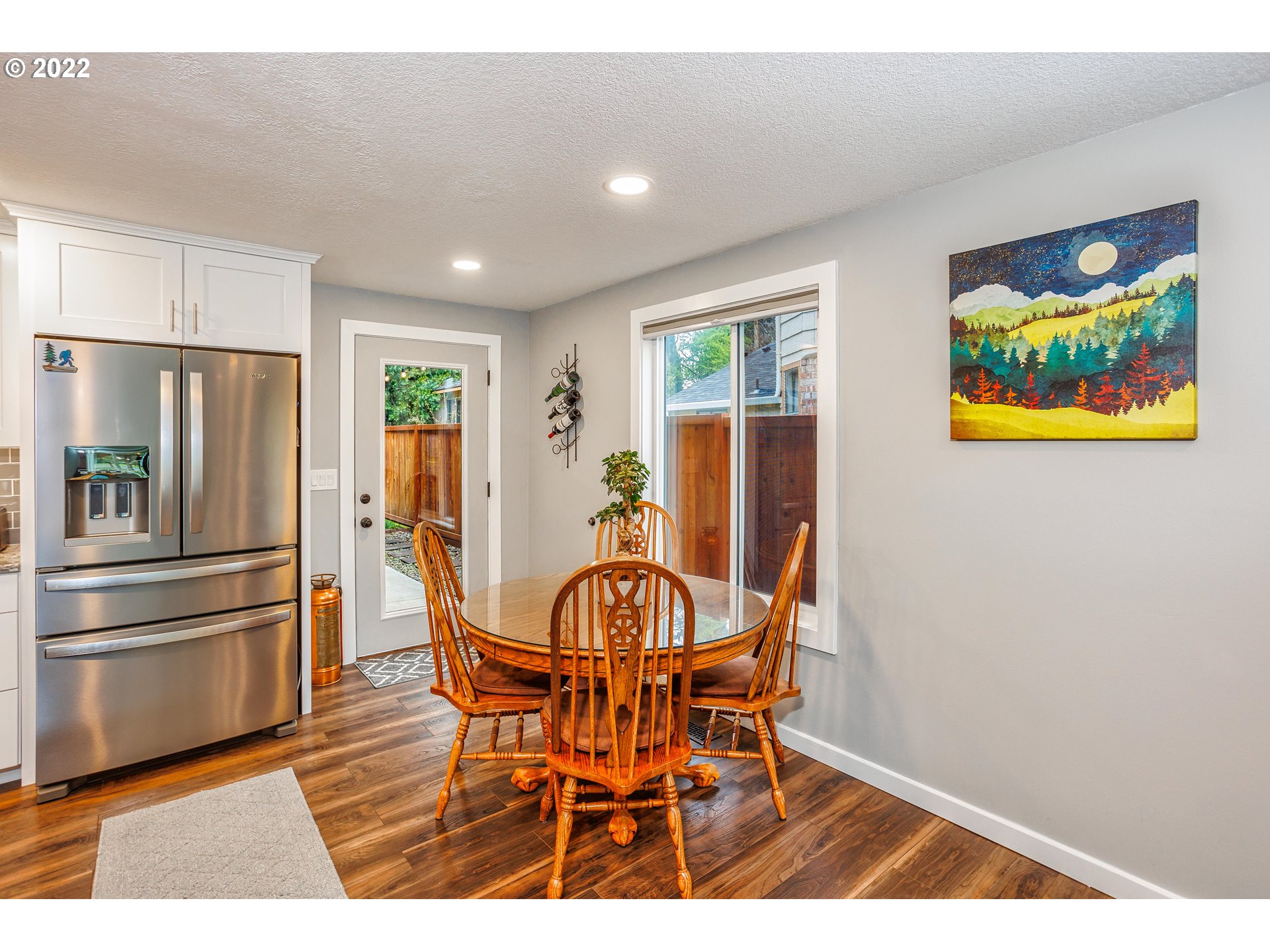 711 North Main Avenue Ridgefield, WA 98642 - Photo 6 of 14 a view of a dining room with furniture window and wooden floor