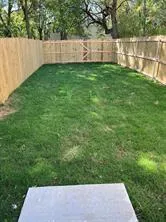 a view of a yard with a bench