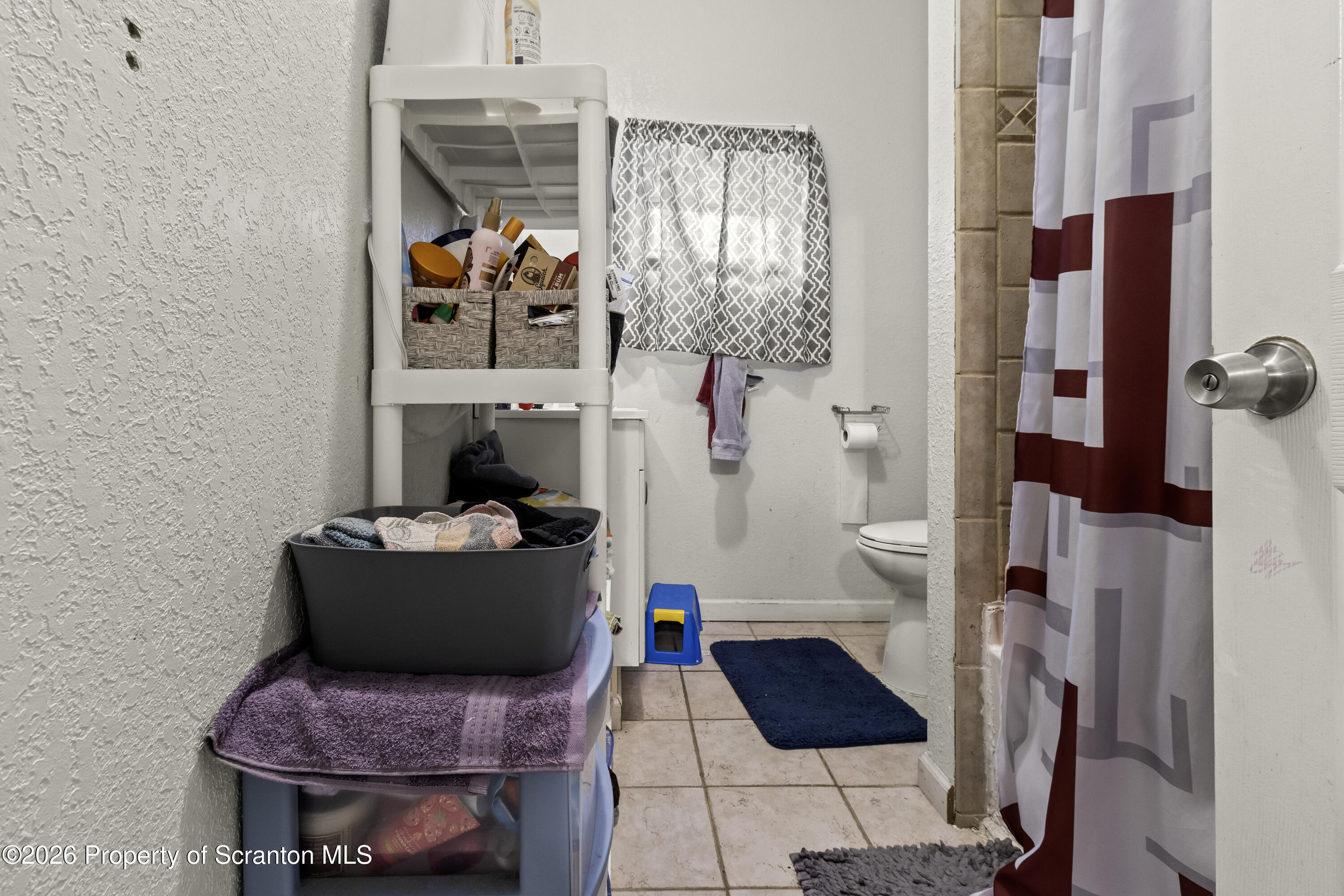 208 Sanderson Avenue Olyphant, PA 18447 - Photo 14 of 31 a living room with furniture and a window