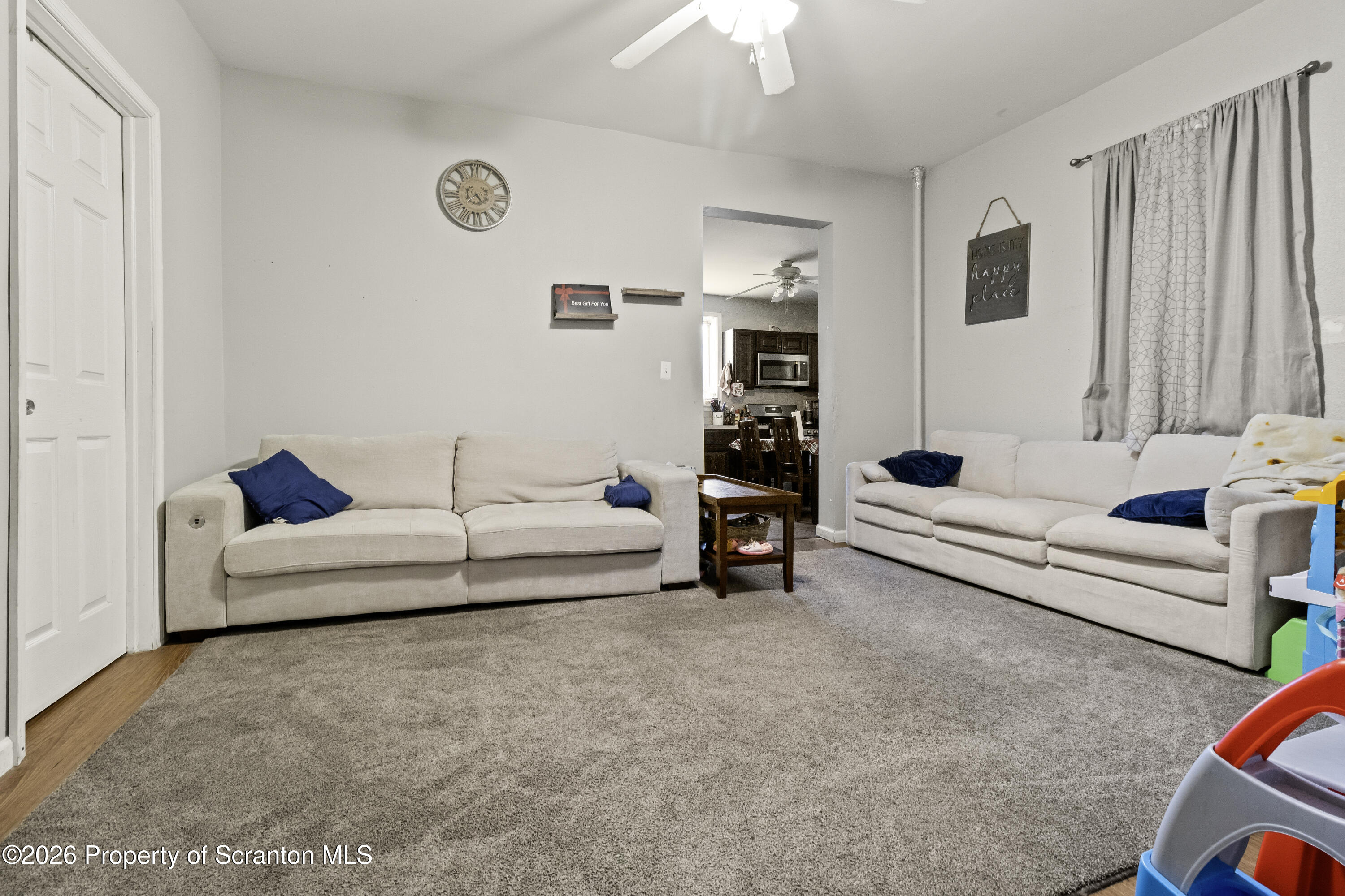 208 Sanderson Avenue Olyphant, PA 18447 - Photo 15 of 31 a living room with furniture and a couch