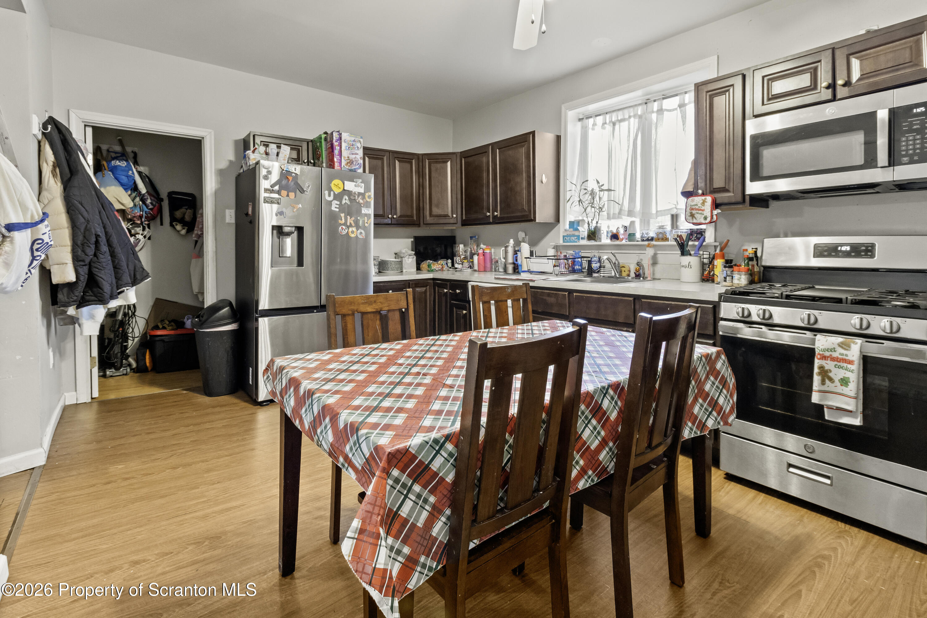 208 Sanderson Avenue Olyphant, PA 18447 - Photo 19 of 31 a kitchen with stainless steel appliances granite countertop a stove a sink dishwasher and cabinets