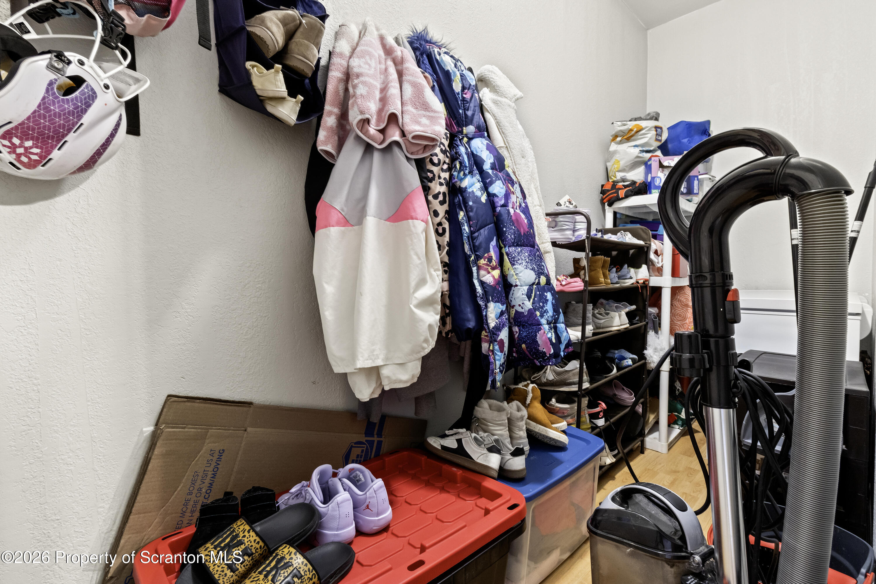 208 Sanderson Avenue Olyphant, PA 18447 - Photo 21 of 31 a view of walk in closet with clothes and shoes