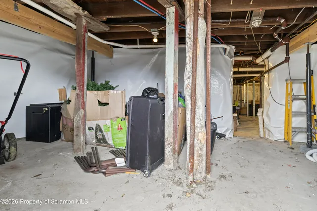 a picture of a bench in front of a wall