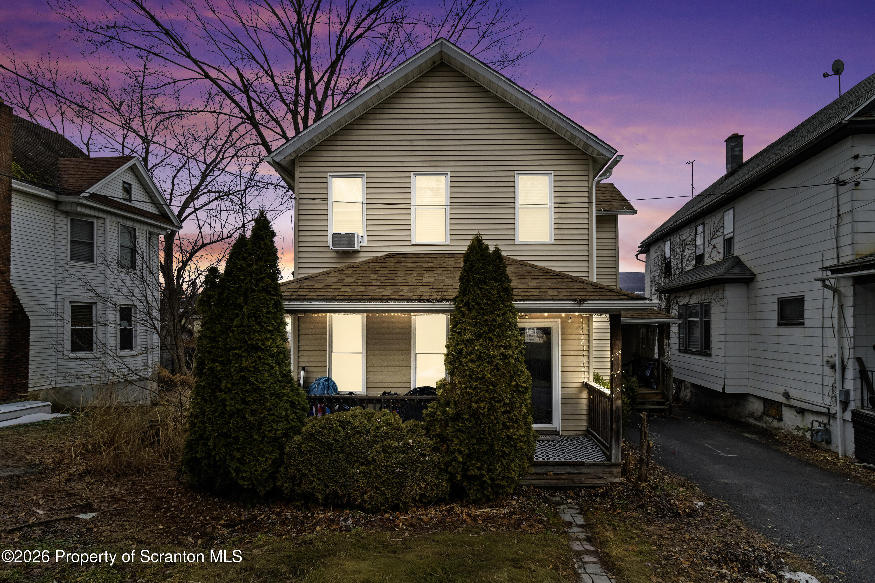 208 Sanderson Avenue Olyphant, PA 18447 - Photo 3 of 31 a front view of a house with a yard