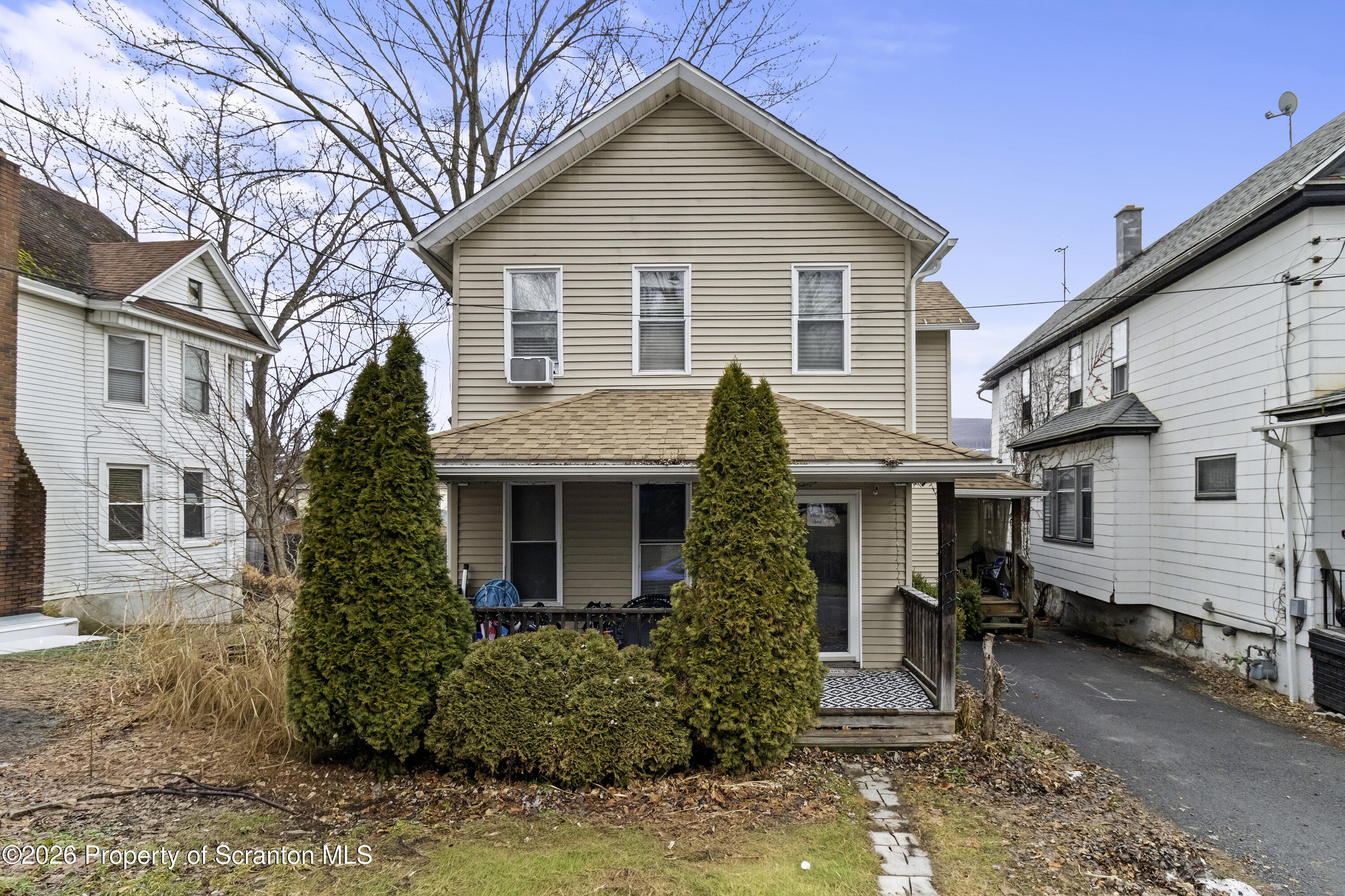 208 Sanderson Avenue Olyphant, PA 18447 - Photo 4 of 31 a front view of a house with garden