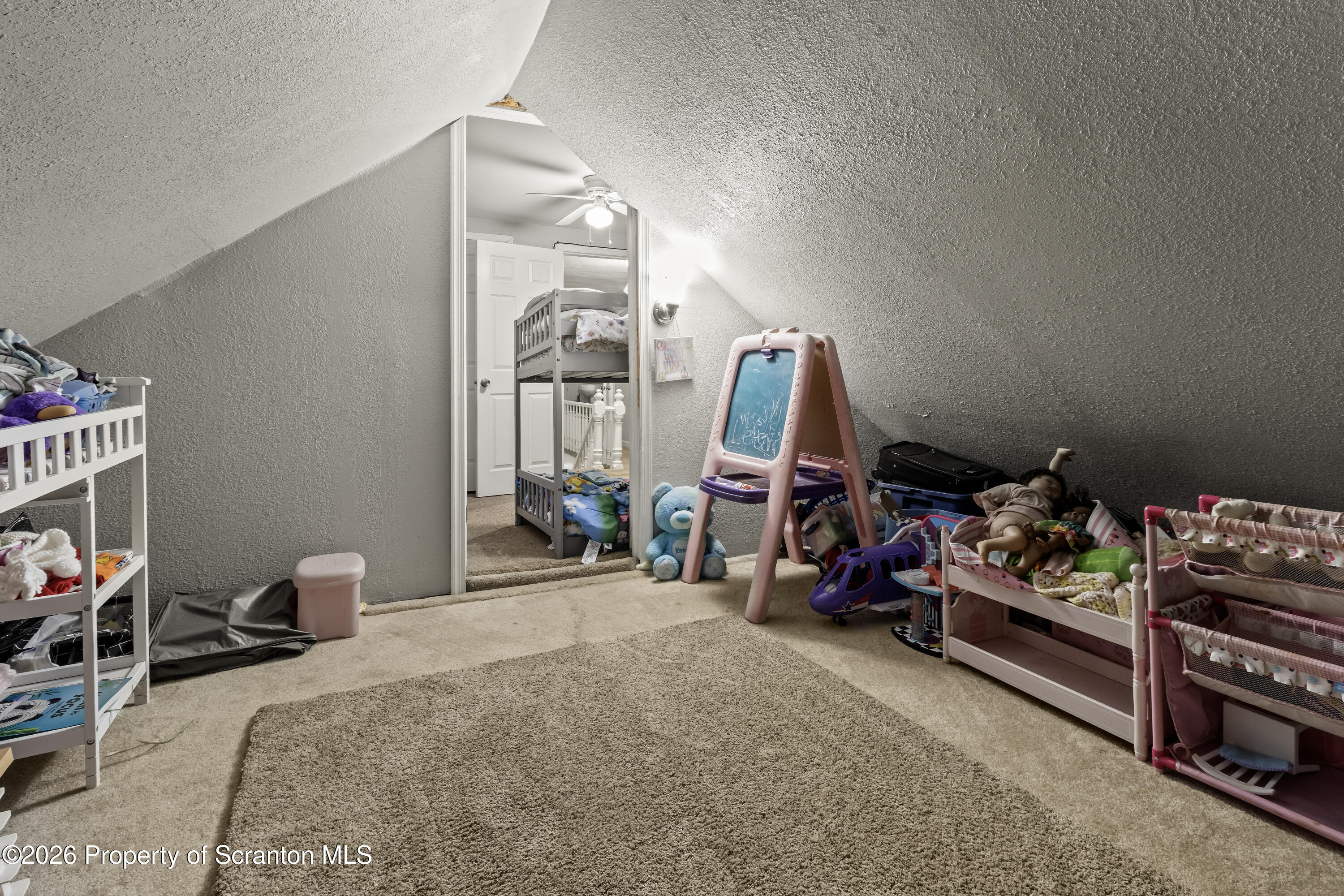 208 Sanderson Avenue Olyphant, PA 18447 - Photo 8 of 31 a bedroom with furniture and a flat screen tv