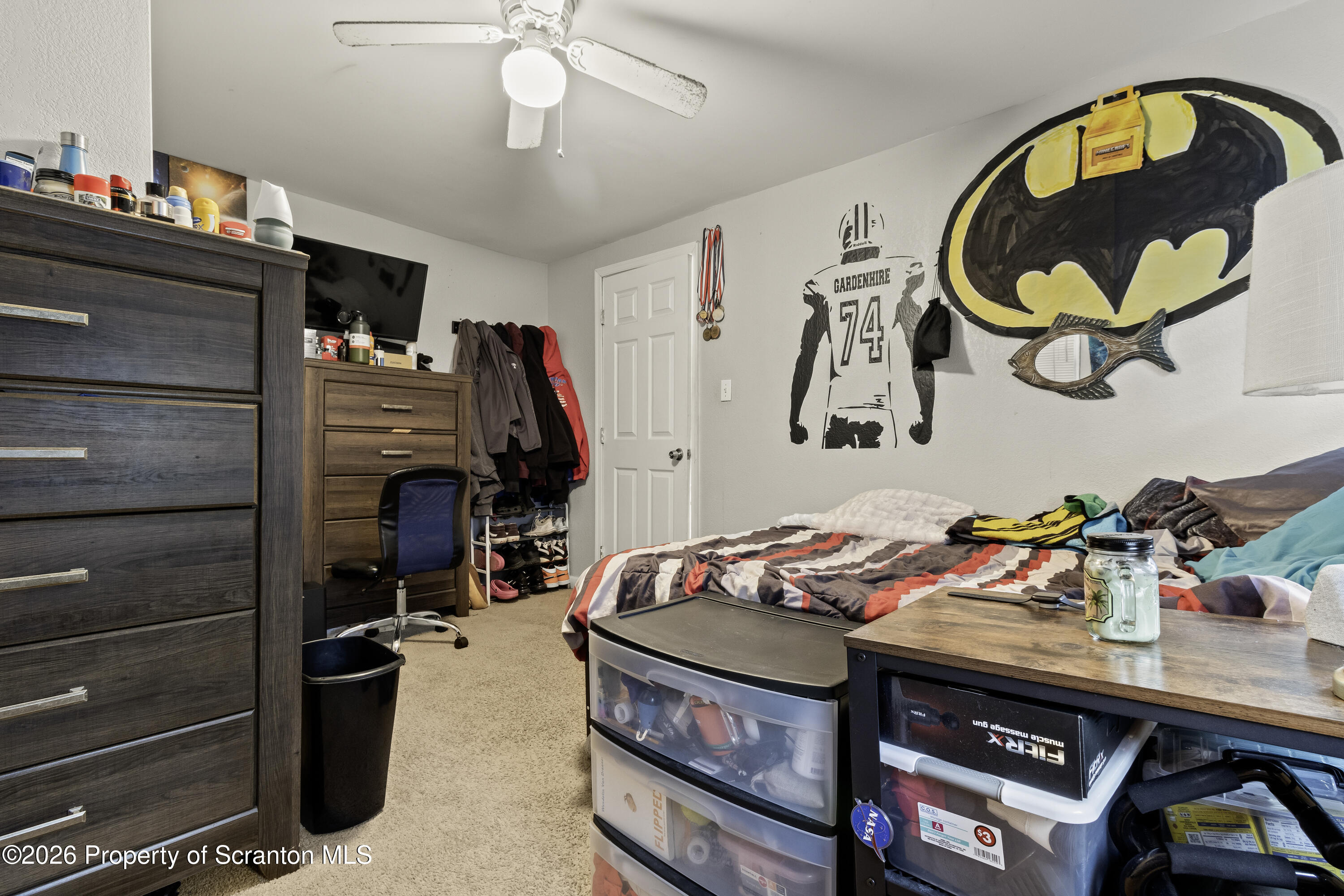 208 Sanderson Avenue Olyphant, PA 18447 - Photo 10 of 31 a bedroom with a bed and dresser