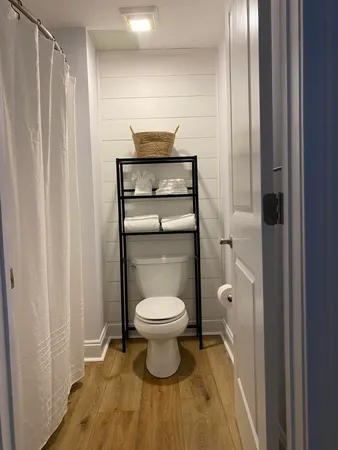 a balcony with wooden floor and lake view