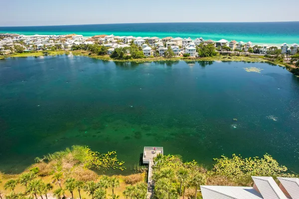 an aerial view of a houses with ocean view