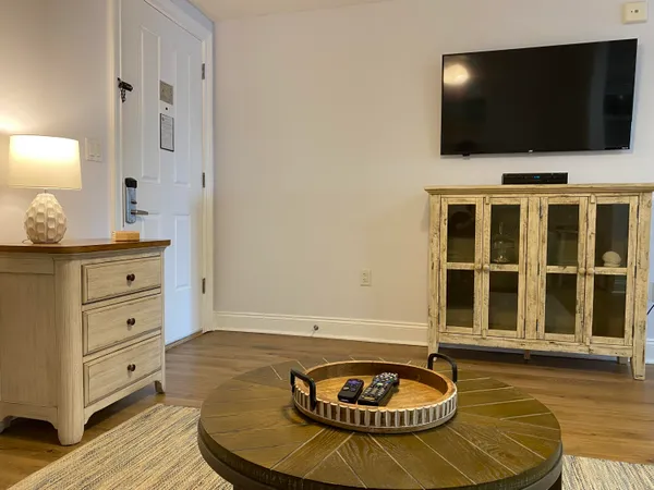 a living room with furniture and a flat screen tv