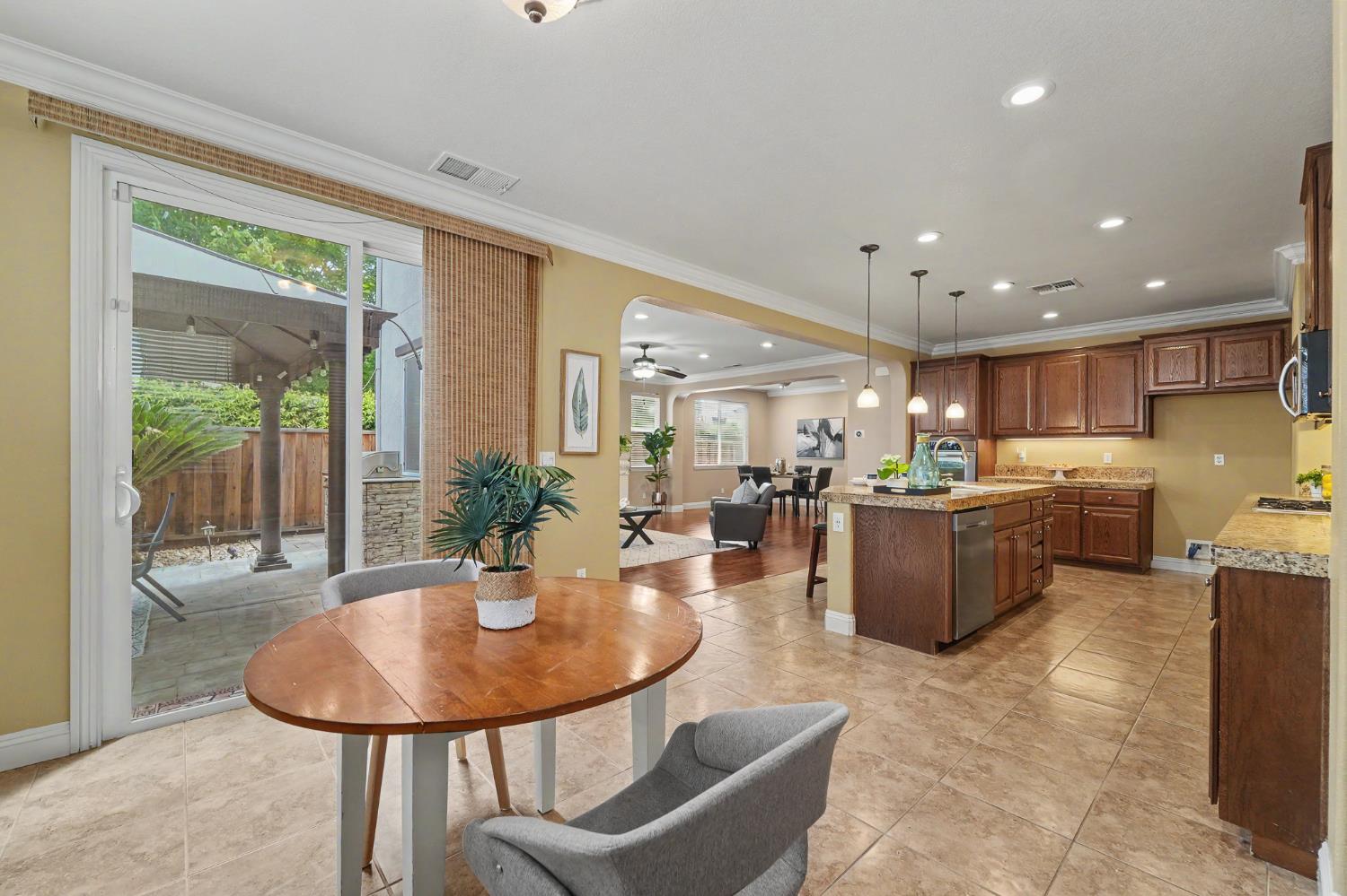 1223 East Springer Drive Turlock, CA 95382 - Photo 19 of 48 a kitchen with a table and chairs