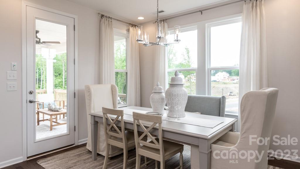 13219 Chopin Ridge Road Huntersville, NC 28078 - Photo 11 of 37 a view of a dining room with furniture window and wooden floor