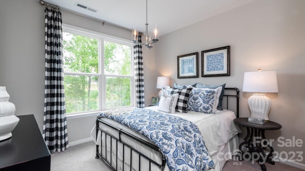 13219 Chopin Ridge Road Huntersville, NC 28078 - Photo 25 of 37 a bedroom with a bed and a window