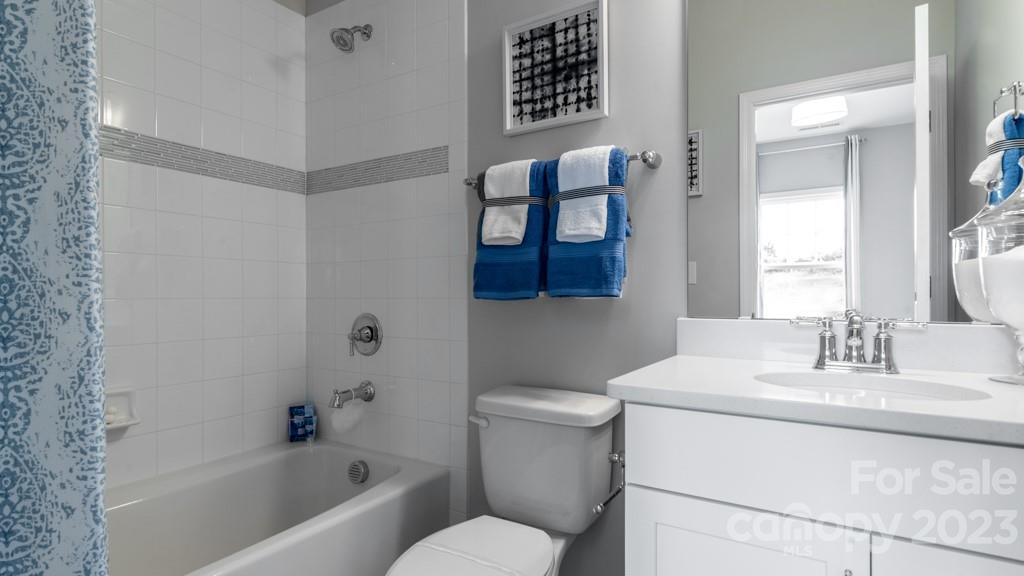 13219 Chopin Ridge Road Huntersville, NC 28078 - Photo 26 of 37 a bathroom with a toilet sink and mirror