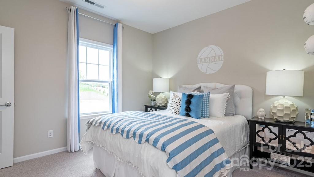 13219 Chopin Ridge Road Huntersville, NC 28078 - Photo 27 of 37 a bedroom with bed and window