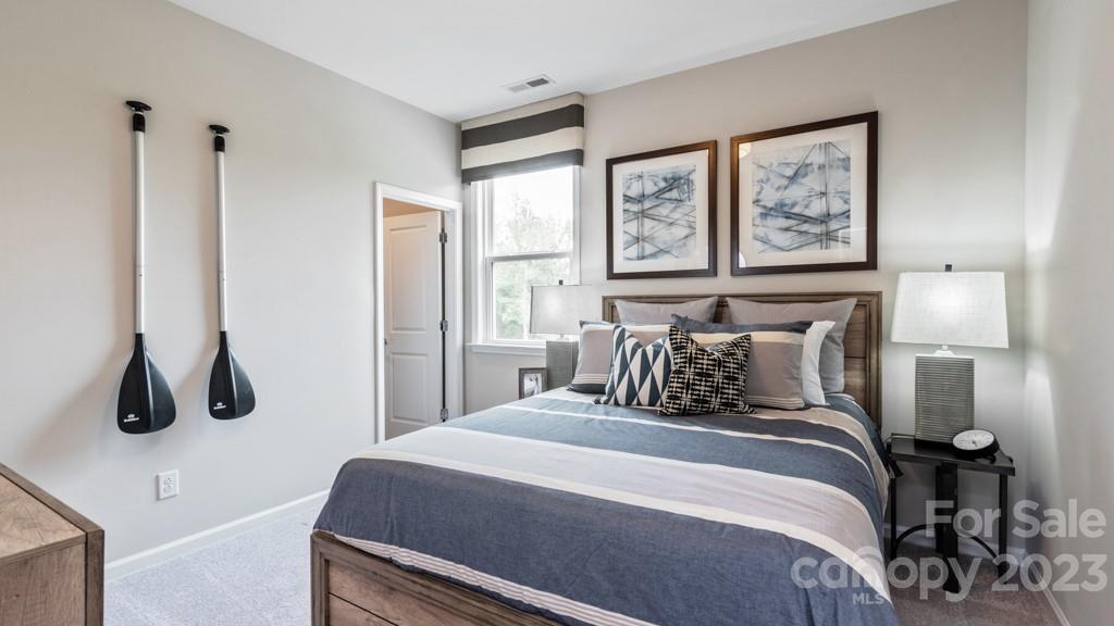 13219 Chopin Ridge Road Huntersville, NC 28078 - Photo 29 of 37 a bedroom with a large bed and a window