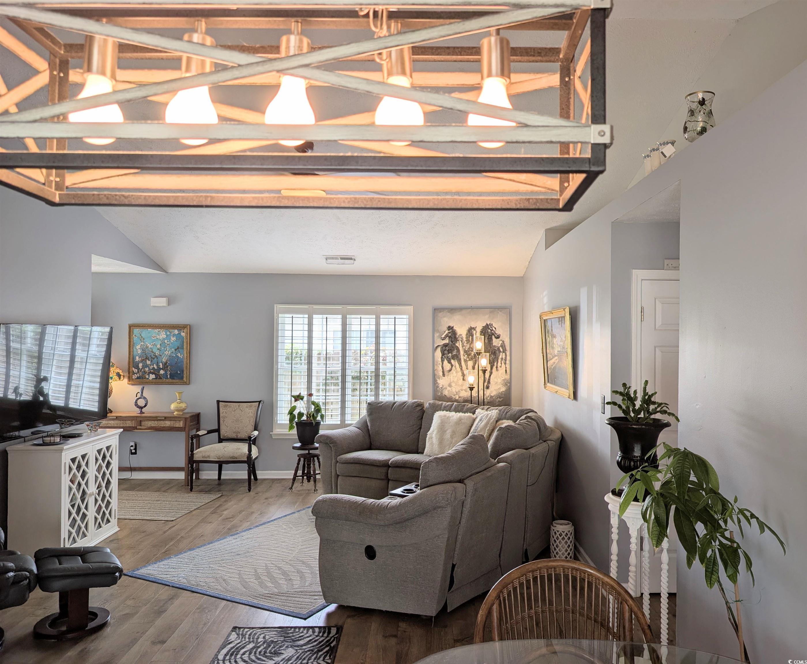 1013 Autumn Drive Murrells Inlet, SC 29576 - Photo 13 of 36 Living room with wood finished floors and high vaulted ceiling