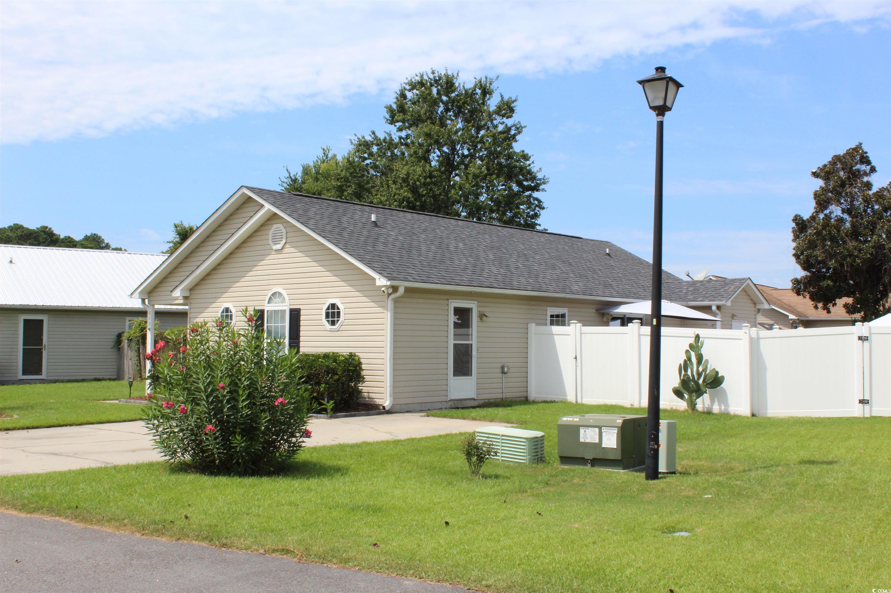 1013 Autumn Drive Murrells Inlet, SC 29576 - Photo 2 of 36 View of front of property with roof with shingles and a patio