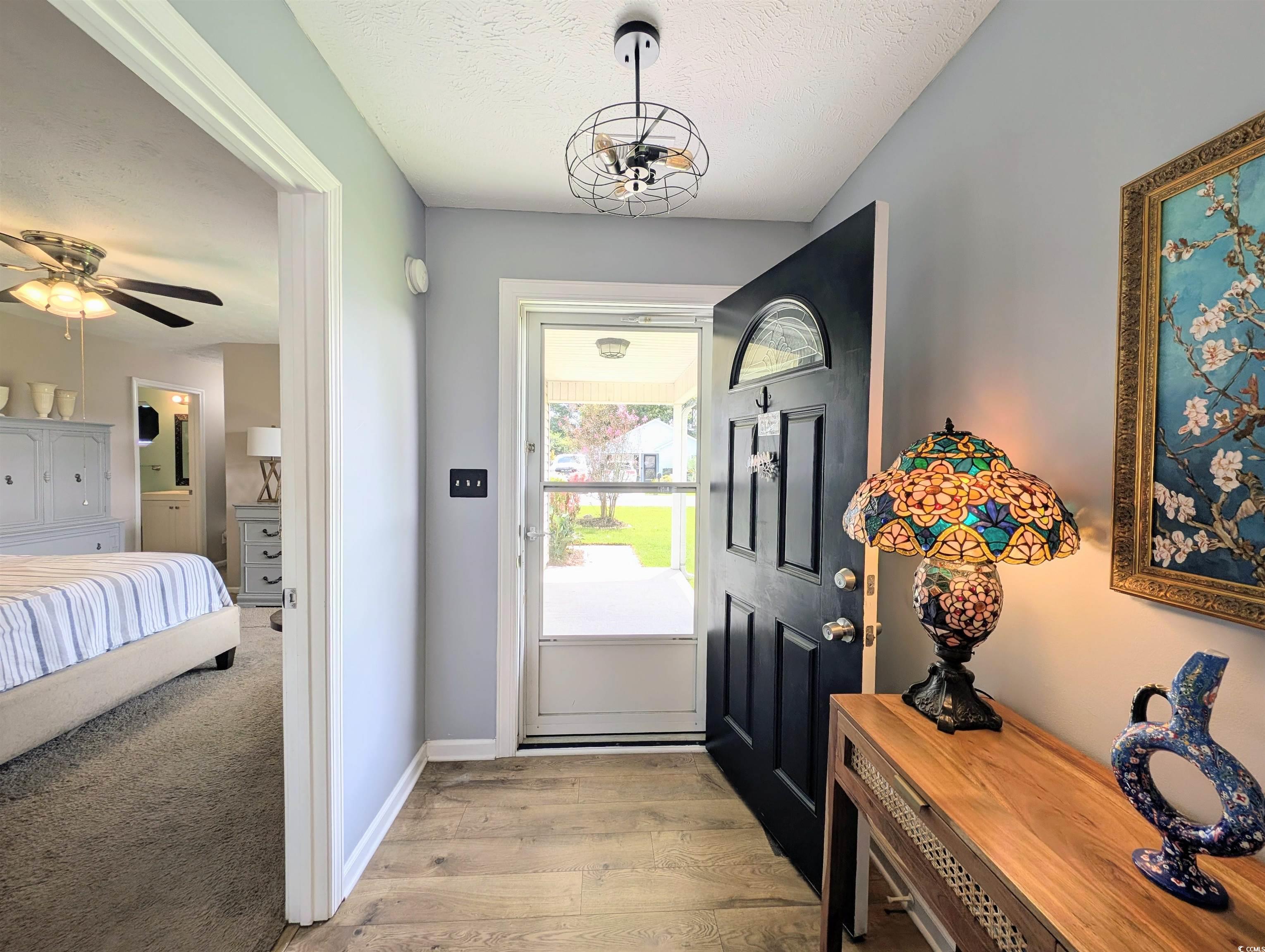 1013 Autumn Drive Murrells Inlet, SC 29576 - Photo 23 of 36 Foyer featuring a textured ceiling and light wood finished floors