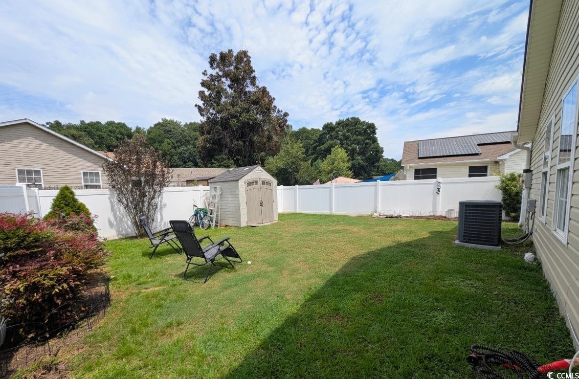 1013 Autumn Drive Murrells Inlet, SC 29576 - Photo 27 of 36 Fenced backyard featuring a shed