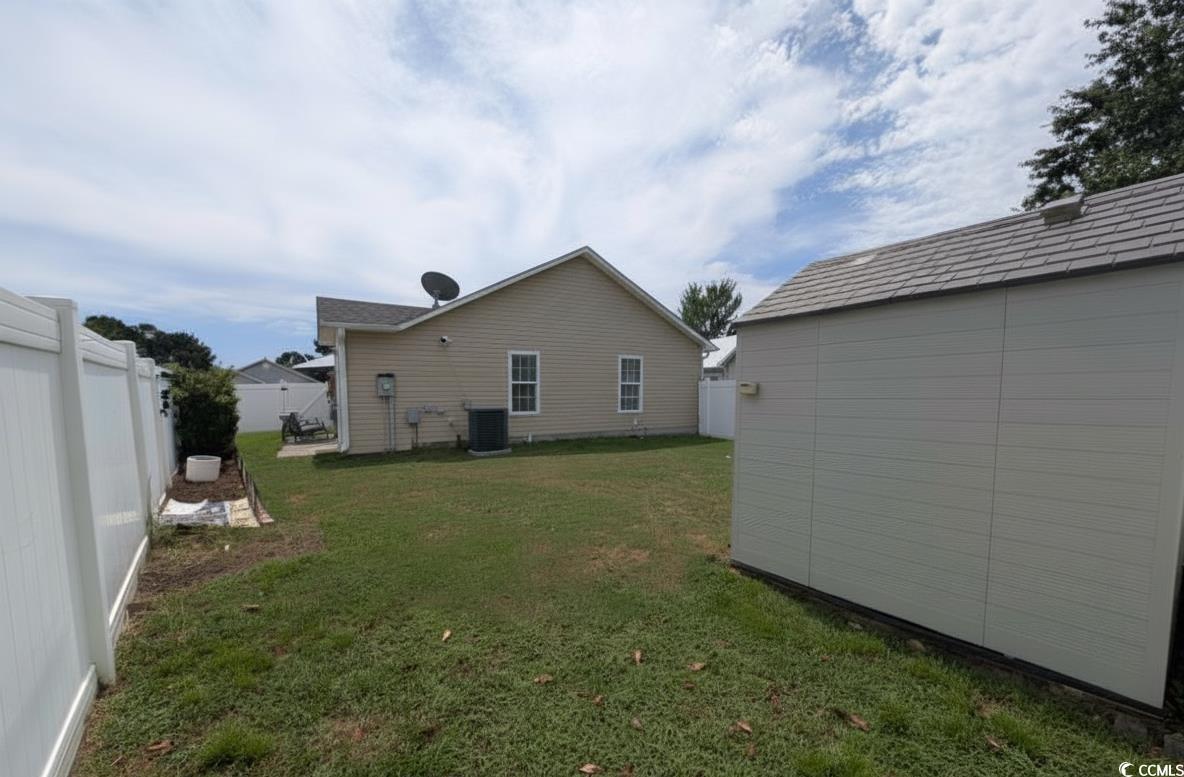 1013 Autumn Drive Murrells Inlet, SC 29576 - Photo 28 of 36 Fenced backyard featuring a storage shed