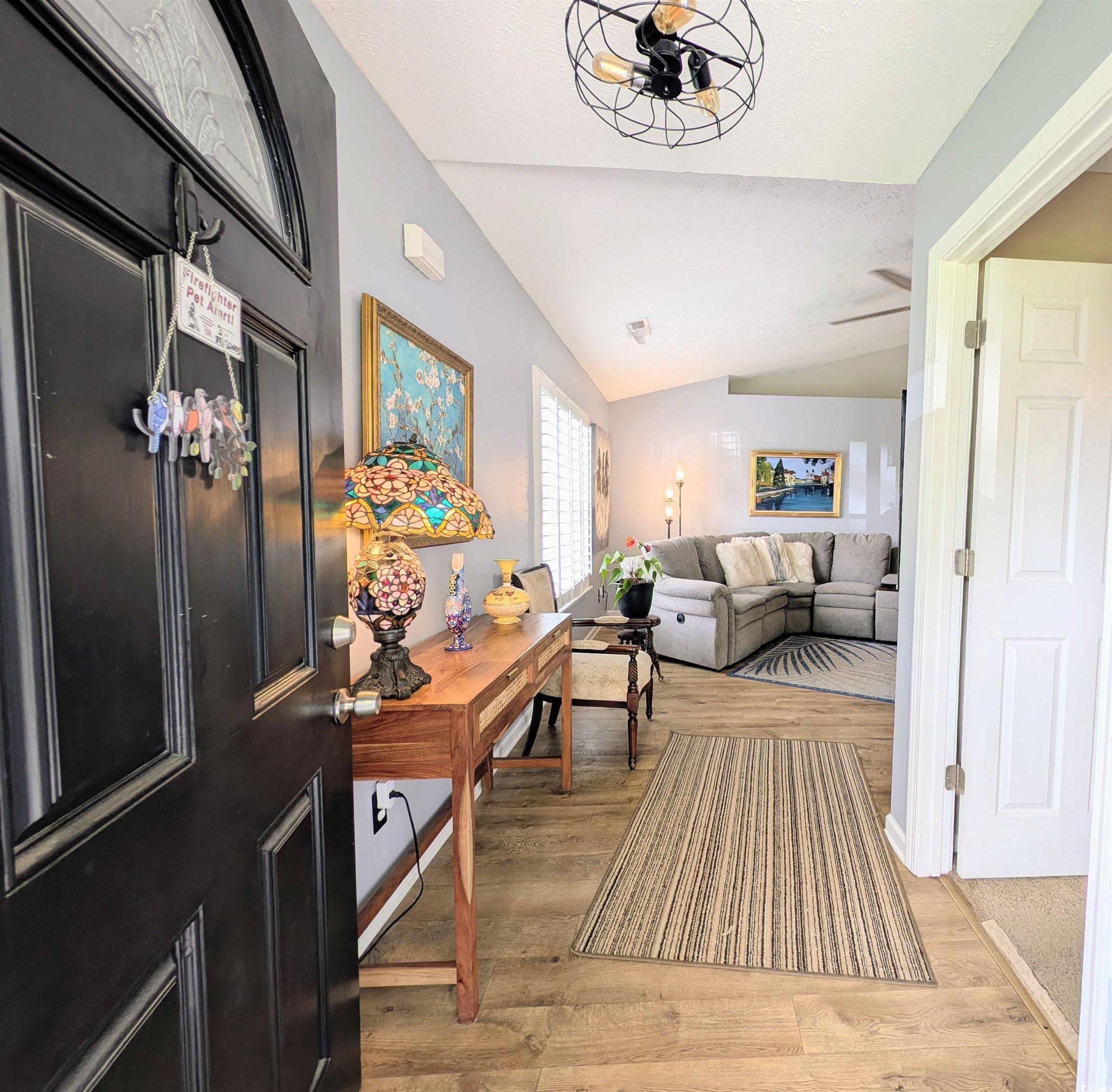 1013 Autumn Drive Murrells Inlet, SC 29576 - Photo 4 of 36 Entrance foyer with vaulted ceiling and light wood-style floors