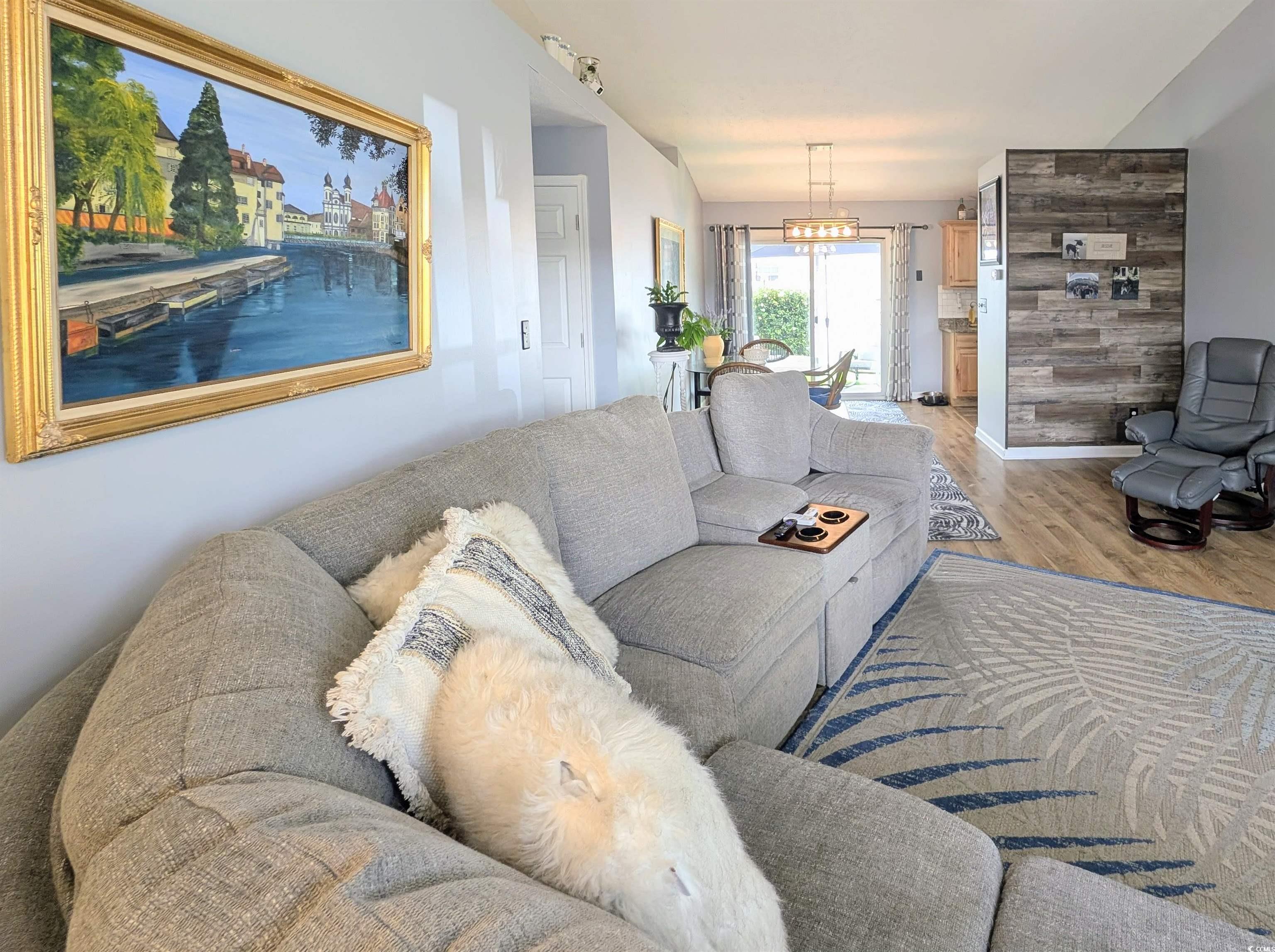1013 Autumn Drive Murrells Inlet, SC 29576 - Photo 7 of 36 Living area with wood finished floors and a chandelier