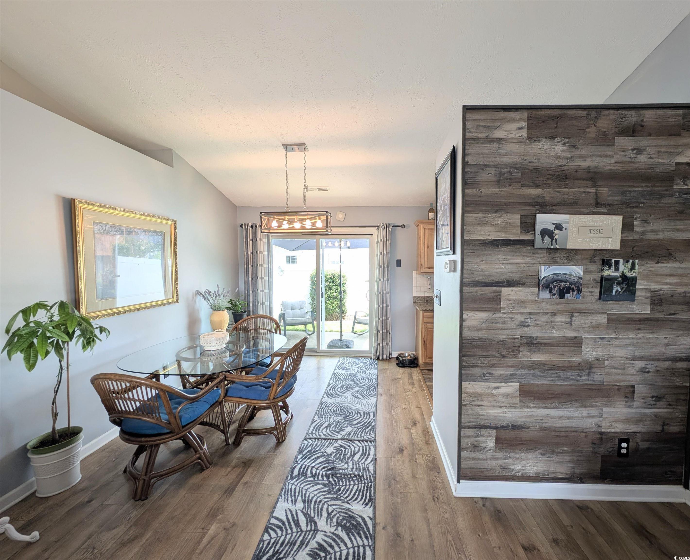 1013 Autumn Drive Murrells Inlet, SC 29576 - Photo 9 of 36 Beautiful accent wall leading to dining area