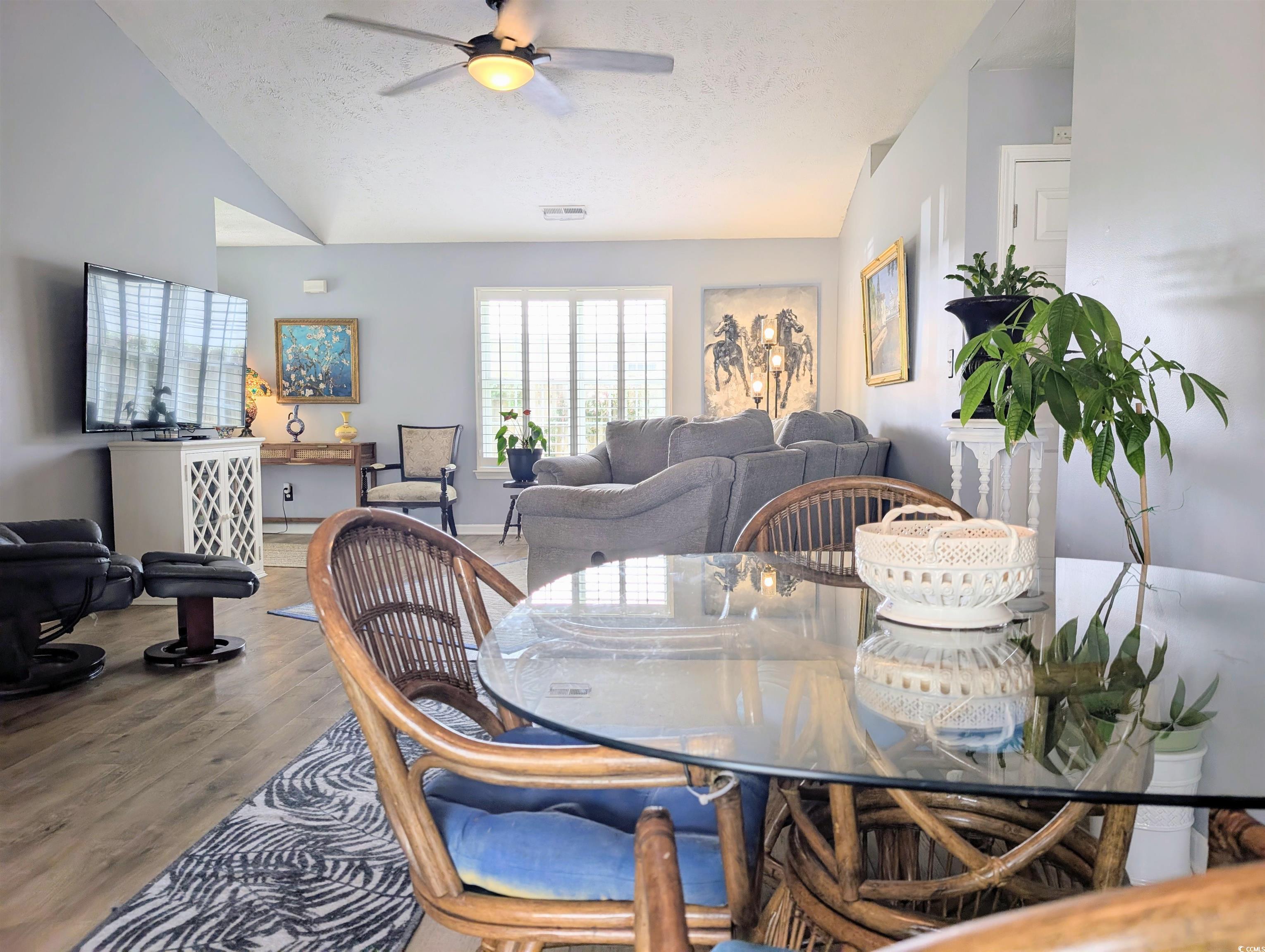 1013 Autumn Drive Murrells Inlet, SC 29576 - Photo 10 of 36 Dining area with vaulted ceiling, wood finished floors, open to the living room.