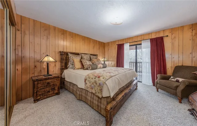 a bed room with a bed and a couch