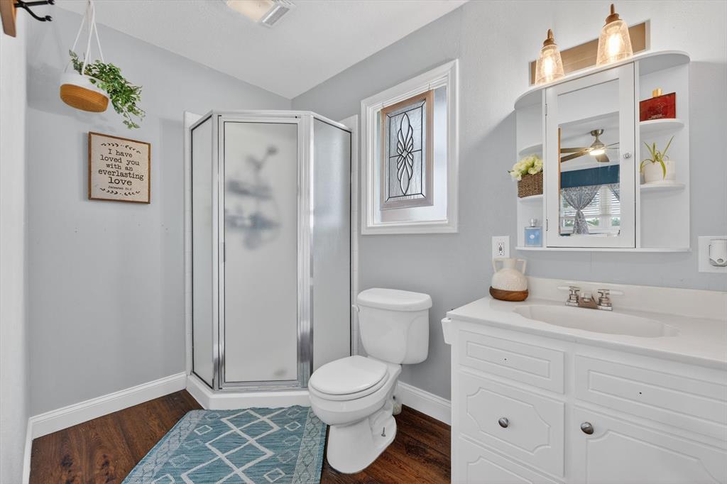 1808 Silver Creek Azle Road Azle, TX 76020 - Photo 18 of 32 a bathroom with a granite countertop toilet sink and shower